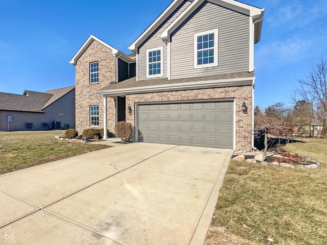 view of front facade featuring a front lawn and a garage