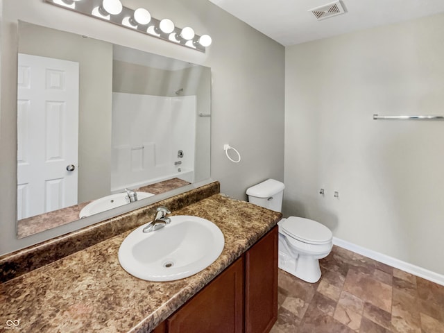 full bathroom with bathing tub / shower combination, vanity, and toilet