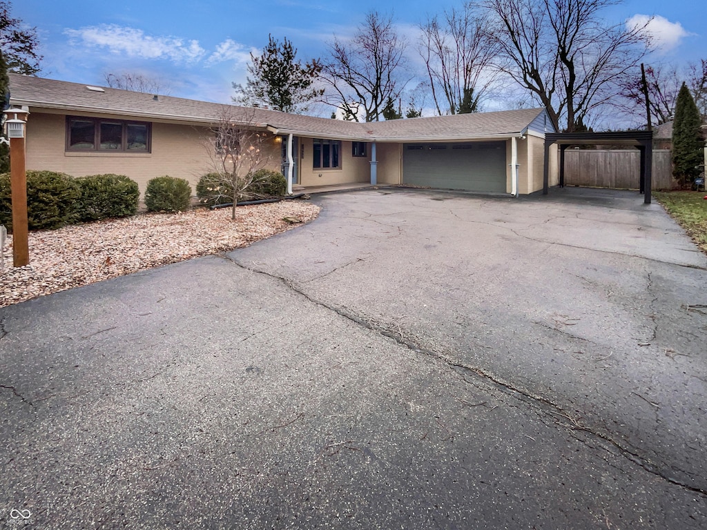 ranch-style home featuring a garage