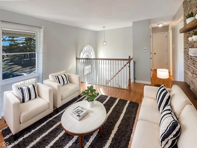 living room featuring wood finished floors and baseboards