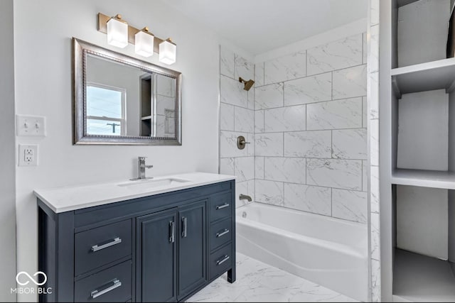 bathroom featuring vanity and tiled shower / bath combo