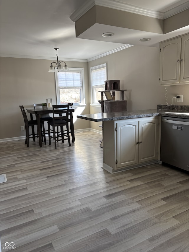 kitchen featuring crown molding, dark countertops, stainless steel dishwasher, light wood-type flooring, and baseboards