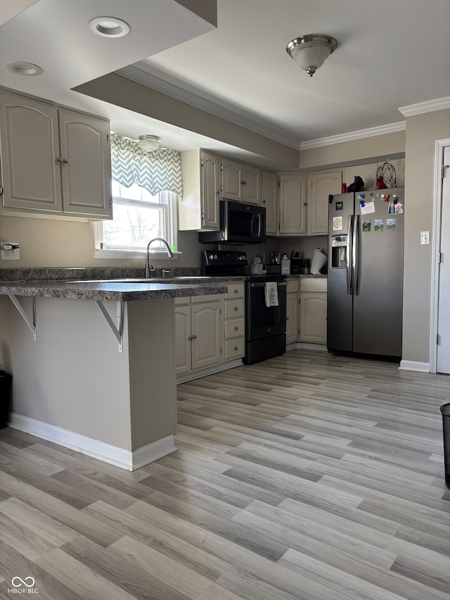 kitchen featuring dark countertops, black / electric stove, a peninsula, and stainless steel fridge with ice dispenser