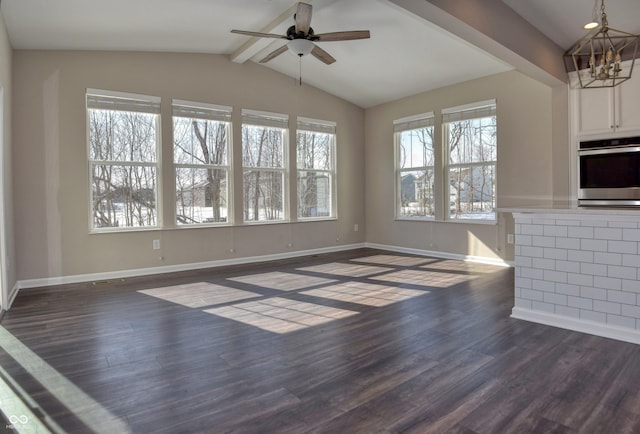 unfurnished living room with vaulted ceiling with beams, baseboards, dark wood finished floors, and ceiling fan with notable chandelier