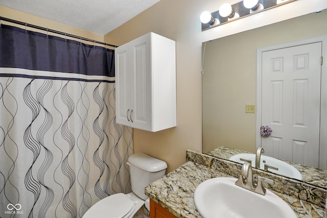 full bath featuring toilet, a textured ceiling, a shower with shower curtain, and vanity