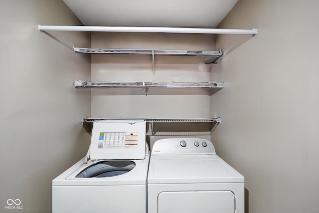 laundry area with laundry area and separate washer and dryer