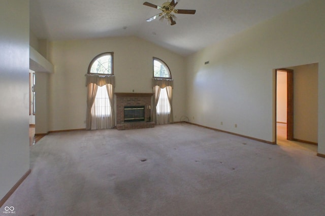 unfurnished living room featuring ceiling fan, light carpet, a fireplace, high vaulted ceiling, and baseboards