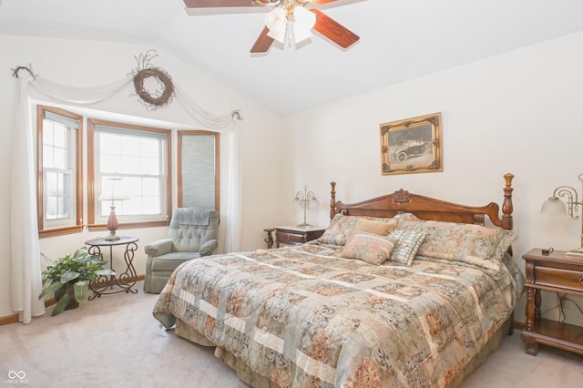 bedroom with carpet floors, baseboards, a ceiling fan, and lofted ceiling