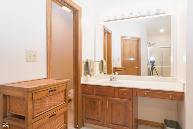 full bath featuring vanity, toilet, and a shower