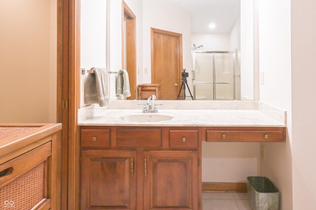full bathroom featuring vanity, tile patterned floors, and a stall shower