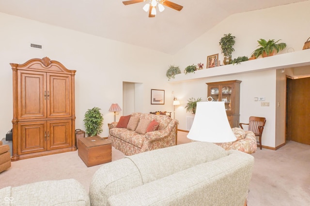 living area with visible vents, a ceiling fan, high vaulted ceiling, and light carpet