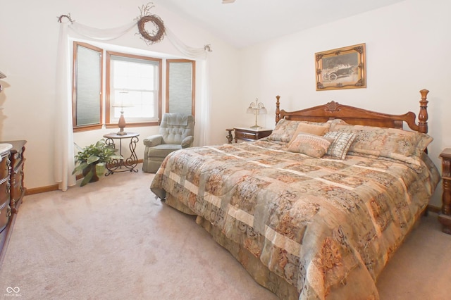 bedroom featuring baseboards and carpet flooring