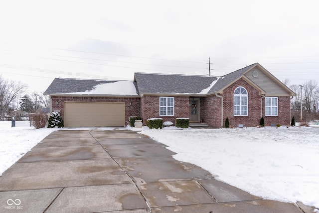 single story home featuring a garage, concrete driveway, and brick siding