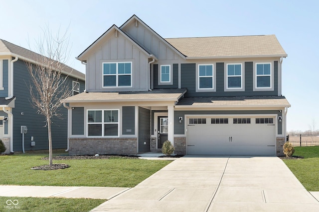 craftsman-style house featuring an attached garage, brick siding, concrete driveway, a front lawn, and board and batten siding