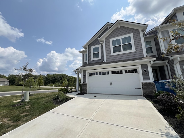 view of front of home featuring a front lawn and a garage