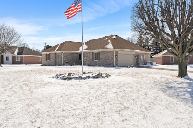 single story home featuring a garage