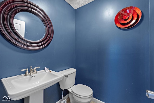 bathroom featuring sink and toilet