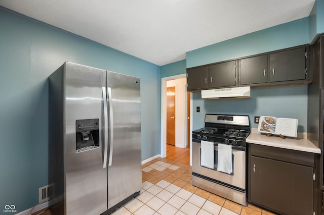 6865 Meadow View Dr, Lawrence, IN 46226 - kitchen featuring appliances with stainless steel finishes, under cabinet range hood, light countertops, and light tile patterned floors