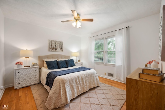 6865 Meadow View Dr, Lawrence, IN 46226 - bedroom featuring light wood-style flooring and a ceiling fan