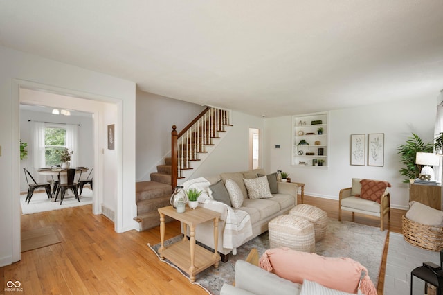 6865 Meadow View Dr, Lawrence, IN 46226 - living area with stairs and light wood-style flooring
