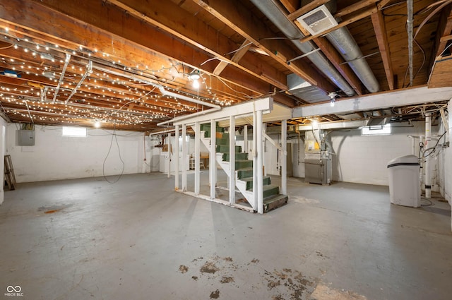 6865 Meadow View Dr, Lawrence, IN 46226 - below grade area with electric panel, stairway, a water softener system, and heating unit