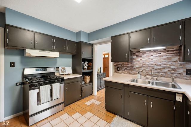 6865 Meadow View Dr, Lawrence, IN 46226 - kitchen with stainless steel gas range oven, under cabinet range hood, tasteful backsplash, and light countertops