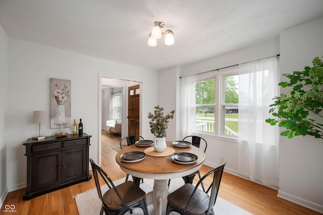 6865 Meadow View Dr, Lawrence, IN 46226 - dining space featuring light wood-style floors and a textured ceiling