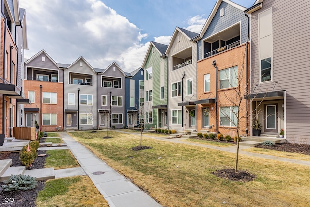 surrounding community with a yard and a residential view