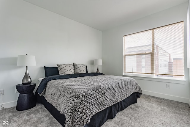 carpeted bedroom with baseboards