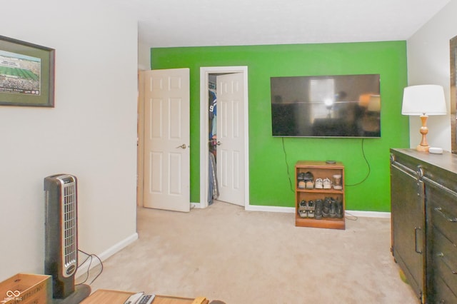 interior space with carpet flooring and baseboards