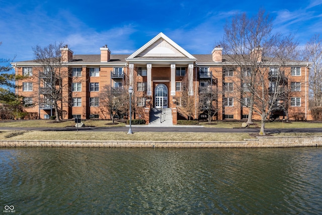 view of building exterior with a water view