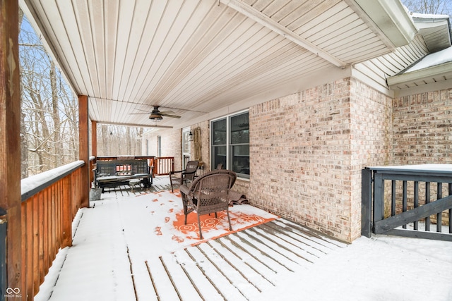 snow covered deck featuring a ceiling fan