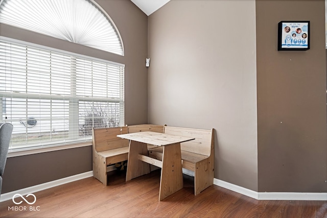 dining room featuring baseboards and wood finished floors