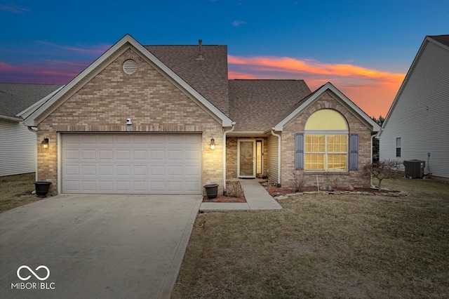 view of front of property featuring brick siding, a shingled roof, concrete driveway, central AC unit, and a garage