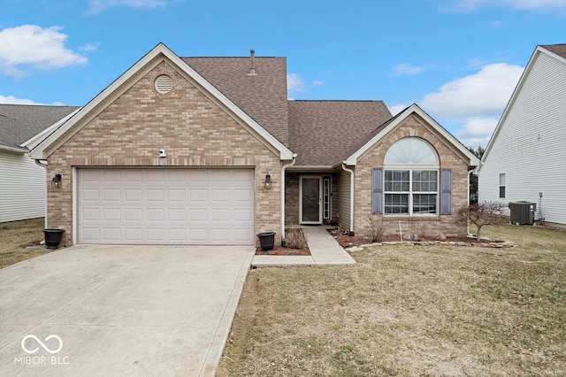 ranch-style home featuring a shingled roof, concrete driveway, an attached garage, central AC, and brick siding