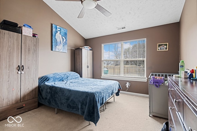 bedroom with lofted ceiling, visible vents, light carpet, a textured ceiling, and baseboards