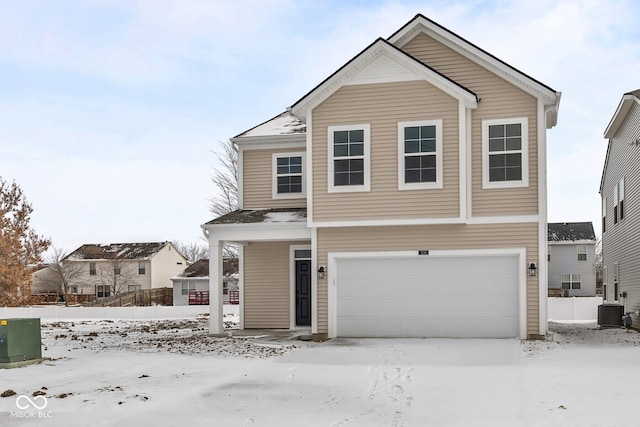 view of front of house with an attached garage, fence, and cooling unit