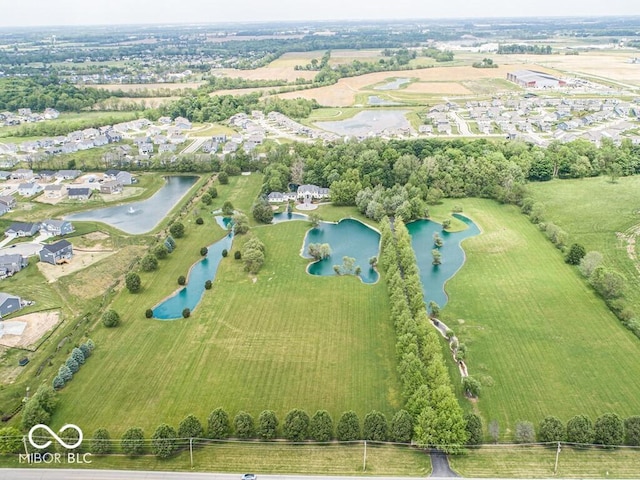 bird's eye view featuring a water view and a residential view