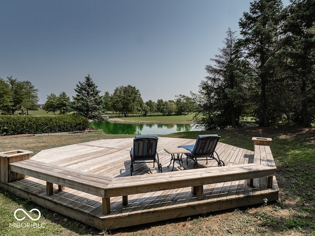 wooden terrace featuring a water view