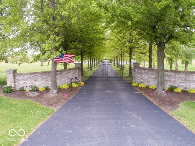 view of gate with fence