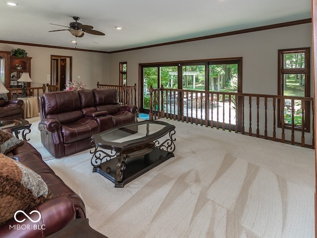 carpeted living room with recessed lighting, a ceiling fan, and crown molding