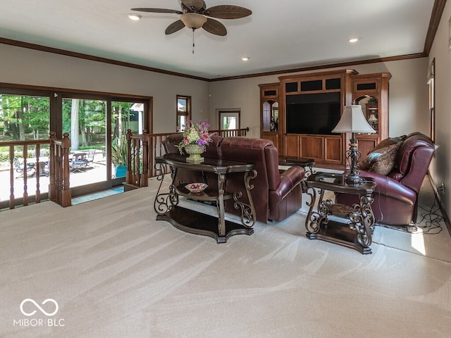 living area with light carpet, ceiling fan, ornamental molding, and recessed lighting