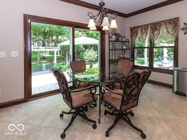 dining area featuring a chandelier, visible vents, crown molding, and baseboards