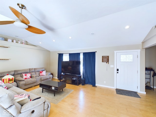 living area with light wood-style floors, baseboards, vaulted ceiling, and recessed lighting