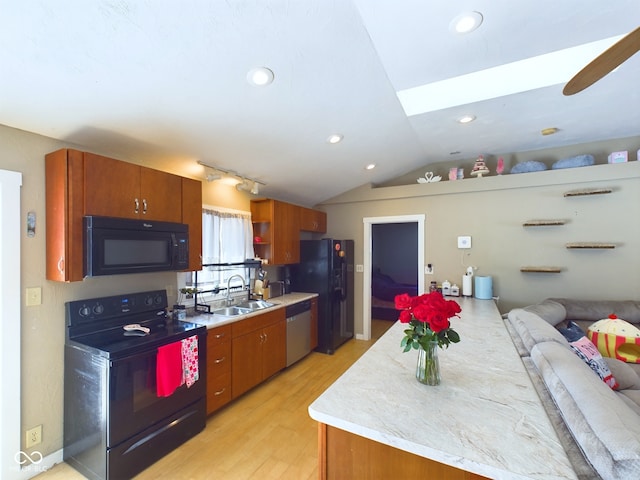 kitchen featuring open shelves, light countertops, vaulted ceiling, a sink, and black appliances