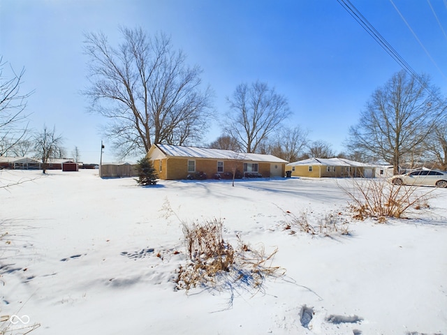 view of snow covered property