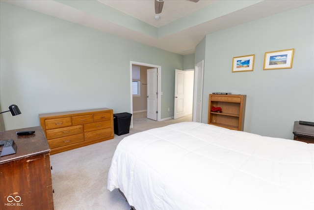 bedroom featuring light carpet and ceiling fan