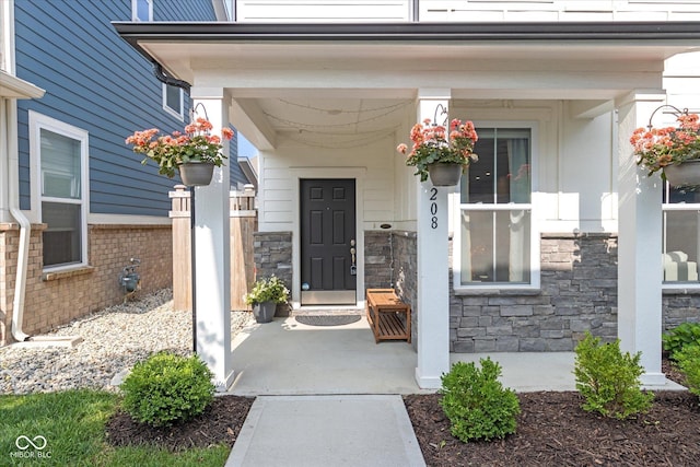 doorway to property with stone siding