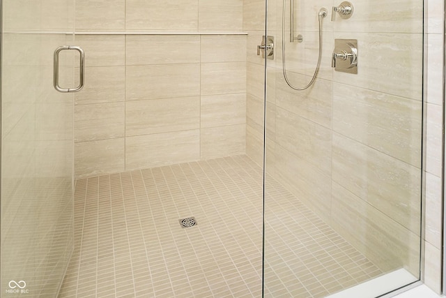 full bath featuring a shower stall