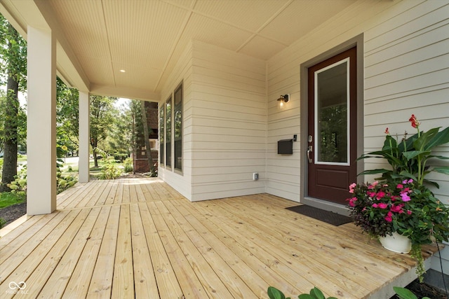 wooden terrace with a porch